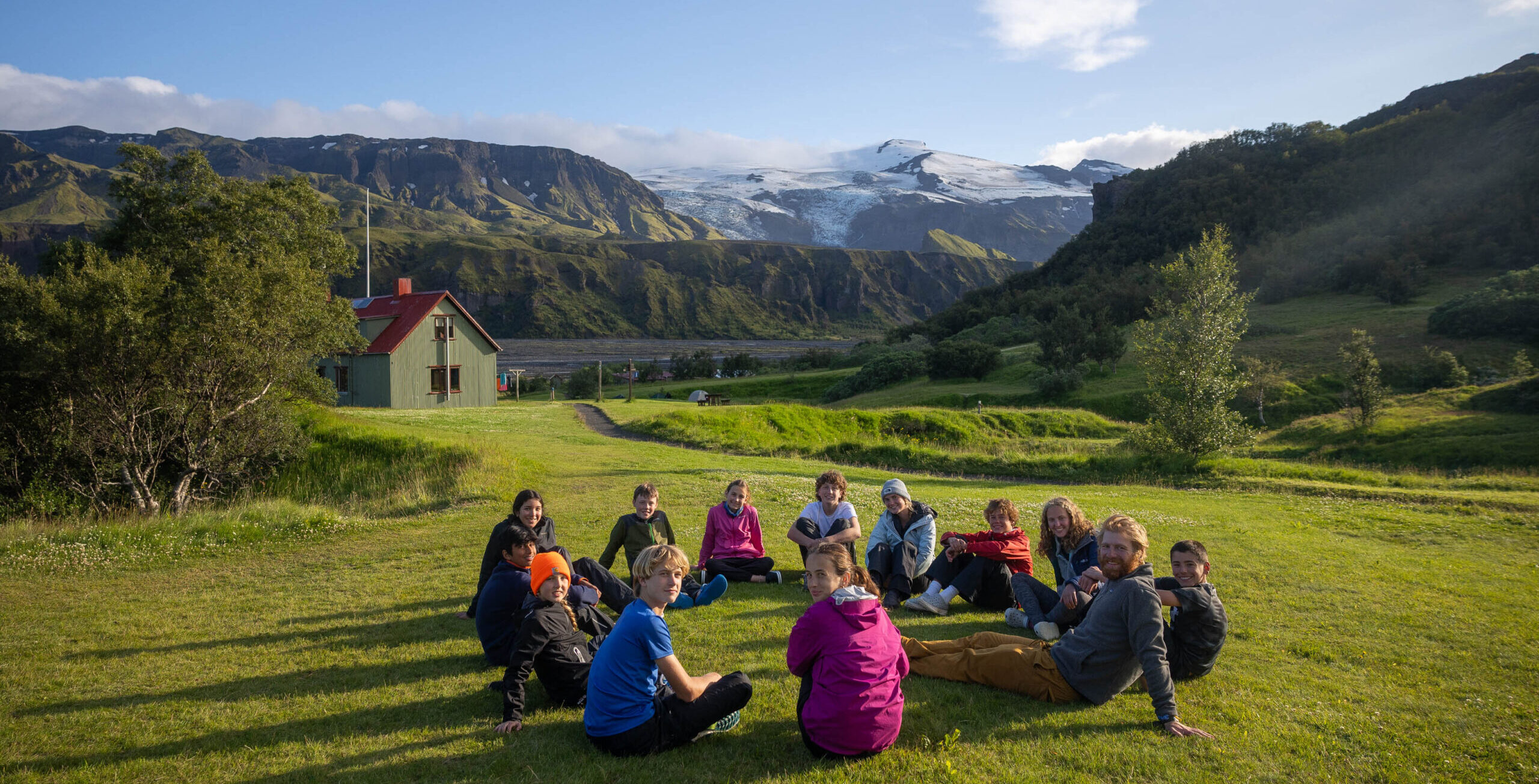 Group relaxing with glacial views