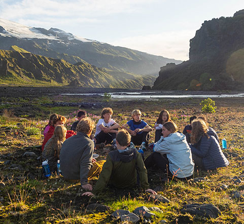 adventure camp teens sitting together