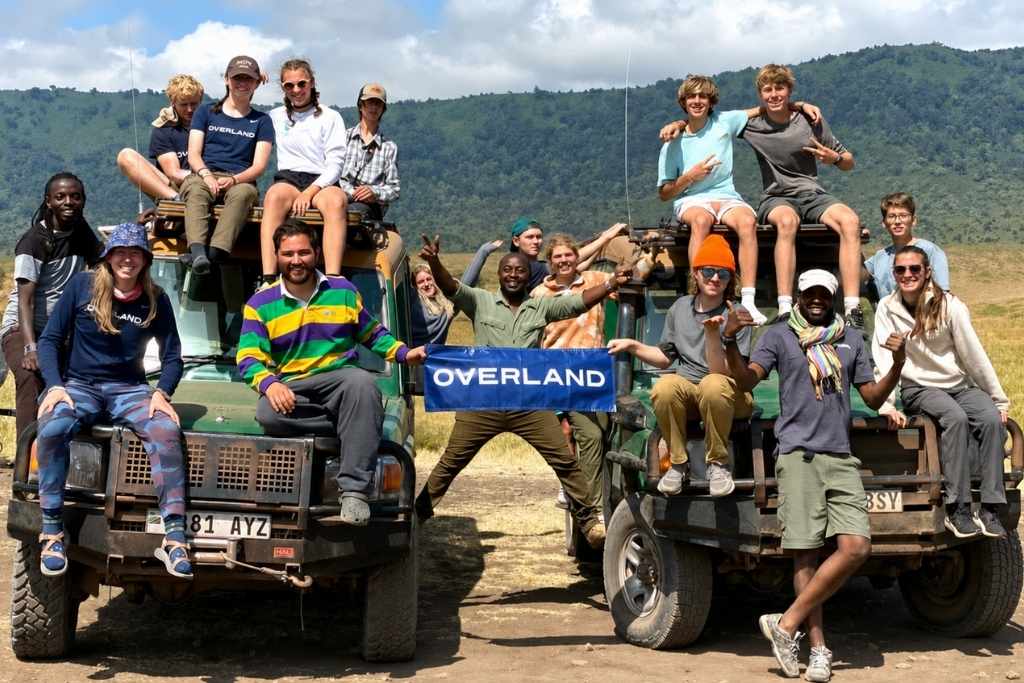 Overland campers and leaders posing together during an outdoor adventure trip