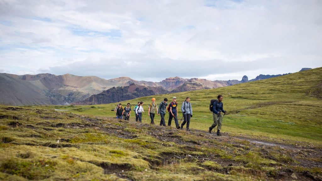 Teens hiking through Iceland’s rugged landscape on the Iceland Explorer trip